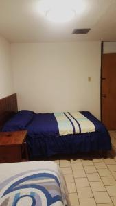 Postel nebo postele na pokoji v ubytování Hotel Centric Chihuahua