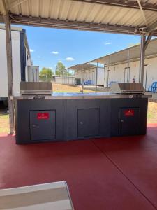 a large counter in a building with at Acacia Village Moranbah in Moranbah