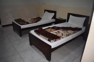 Cama ou camas em um quarto em Hotel Khursheed Palace