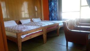 Postel nebo postele na pokoji v ubytování Vijay Mount View