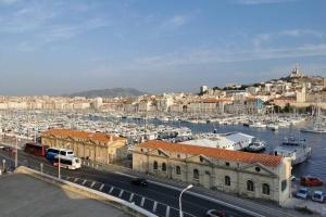 a city with a marina and a harbor with boats at T2 à deux pas du Mucem au Panier / Vieux Port in Marseille