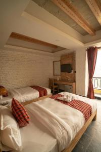 Uma cama ou camas num quarto em Hotel Mera Peak Private Limited