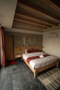 Uma cama ou camas num quarto em Hotel Mera Peak Private Limited