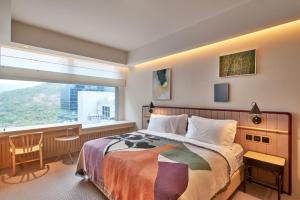 A bed or beds in a room at the Arca