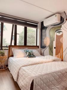 Postel nebo postele na pokoji v ubytování HnH homestay