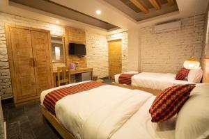 Uma cama ou camas num quarto em Hotel Mera Peak Private Limited