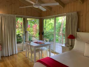 a bedroom with a bed and a table and chairs at Belle's at Montville in Montville