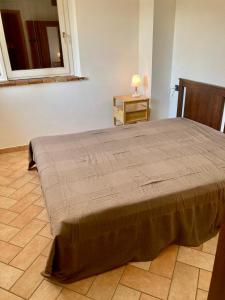 מיטה או מיטות בחדר ב-S214 - Sirolo, trilocale con giardino in zona tranquilla