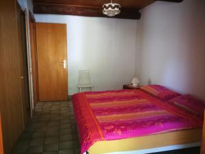 Postel nebo postele na pokoji v ubytování Rustico Bietto