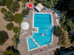an overhead view of a large swimming pool at Aphrodite Apartments in Kallithea Rhodes