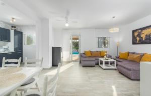 a living room with a couch and a table at Villa Pendolina with Private Pool in Buje