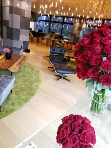 a lobby with a large bouquet of red roses at Royal Twin Hotel Kyoto Hachijoguchi in Kyoto