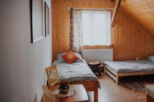 Posteľ alebo postele v izbe v ubytovaní Dom Gościnny Sowia Stópka