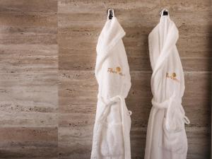a pair of white towels hanging on a wall at Hotel Fonte Velha in Ponte da Barca +33 photos