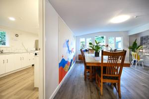 a kitchen and dining room with a table and chairs at U Boutique on Haven in Nelson