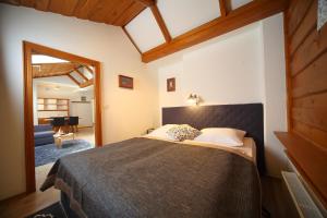 a bedroom with a large bed in a room at Vila Edelweiss Rooms&App Kranjska Gora in Kranjska Gora +184 photos