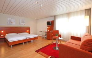 A bed or beds in a room at Aarauerhof - Self Check-in