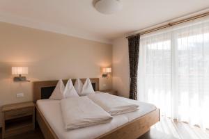 Postel nebo postele na pokoji v ubytování Apparthotel Zunneler