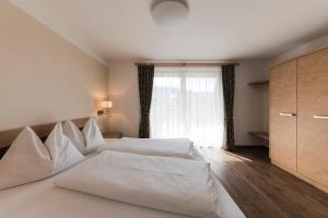 Postel nebo postele na pokoji v ubytování Apparthotel Zunneler