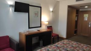 TV a/nebo společenská místnost v ubytování Hotel Bagoeira
