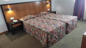 Postel nebo postele na pokoji v ubytování Hotel Bagoeira
