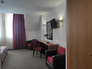 TV a/nebo společenská místnost v ubytování Hotel Bagoeira