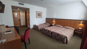 Postel nebo postele na pokoji v ubytování Hotel Bagoeira