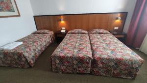 Postel nebo postele na pokoji v ubytování Hotel Bagoeira