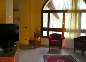 TV a/nebo společenská místnost v ubytování Hotel PALAS