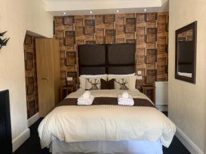 Postel nebo postele na pokoji v ubytování Arran Lodge B&B
