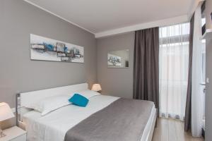 Posteľ alebo postele v izbe v ubytovaní Apartments ZoomZoom + 37 fotografií