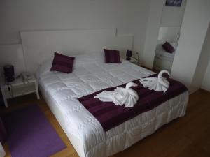 Posteľ alebo postele v izbe v ubytovaní Villa Rigo Panzió