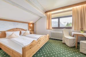 Postel nebo postele na pokoji v ubytování Gasthof Schroll