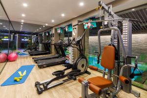 a gym with several treadmills and exercise bikes at Amiral Palace Hotel Boutique Class in Istanbul