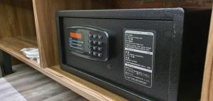 a microwave oven sitting on a shelf at VISTA HOTEL in Tawau