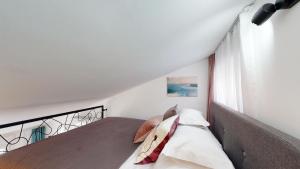 Postel nebo postele na pokoji v ubytování Villa Nono Penthouse Apartment