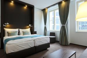 Кровать или кровати в номере Motel One Prague-Florentinum