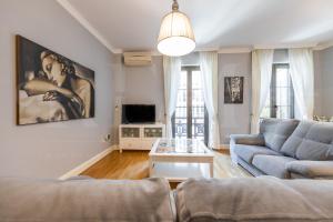 a living room with a couch and a table at Uncibay Deluxe in Málaga