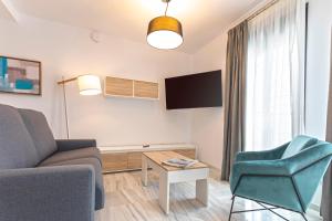 Televízia a/alebo spoločenská miestnosť v ubytovaní Málaga Rivas 34 Suites Homes