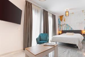 Posteľ alebo postele v izbe v ubytovaní Málaga Rivas 34 Suites Homes