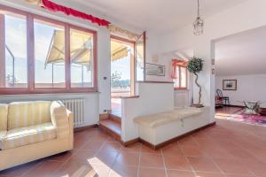 a living room with a couch and a window at RESIDENZE ARANCIO - Premium Villas in Giulianova