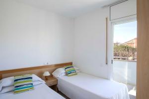 Posteľ alebo postele v izbe v ubytovaní Apartaments La Torreta