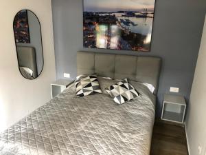 a bedroom with a bed with two pillows on it at Apartment MAK with free parking in Pula