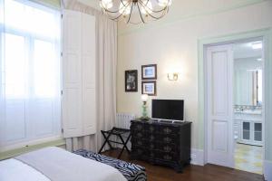 Cama ou camas em um quarto em Casa da Granja Boutique