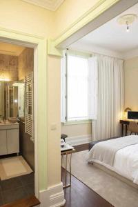 Cama ou camas em um quarto em Casa da Granja Boutique