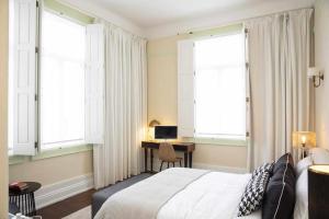 Cama ou camas em um quarto em Casa da Granja Boutique
