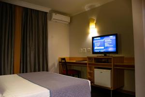 TV a/nebo společenská místnost v ubytování Hotel Exclusivo