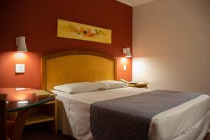 Postel nebo postele na pokoji v ubytování Hotel Exclusivo