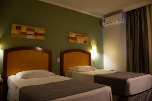 Postel nebo postele na pokoji v ubytování Hotel Exclusivo + 18 fotografií