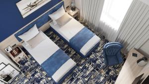 an overhead view of a hotel room with two beds at Hotel Aviator Sheremetyevo in Moscow